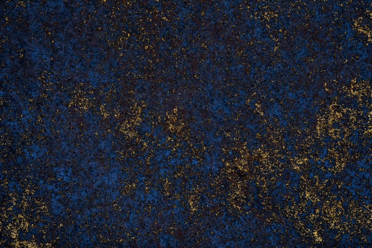 Deep blue abstract texture with golden highlights creating a luxurious and elegant visual